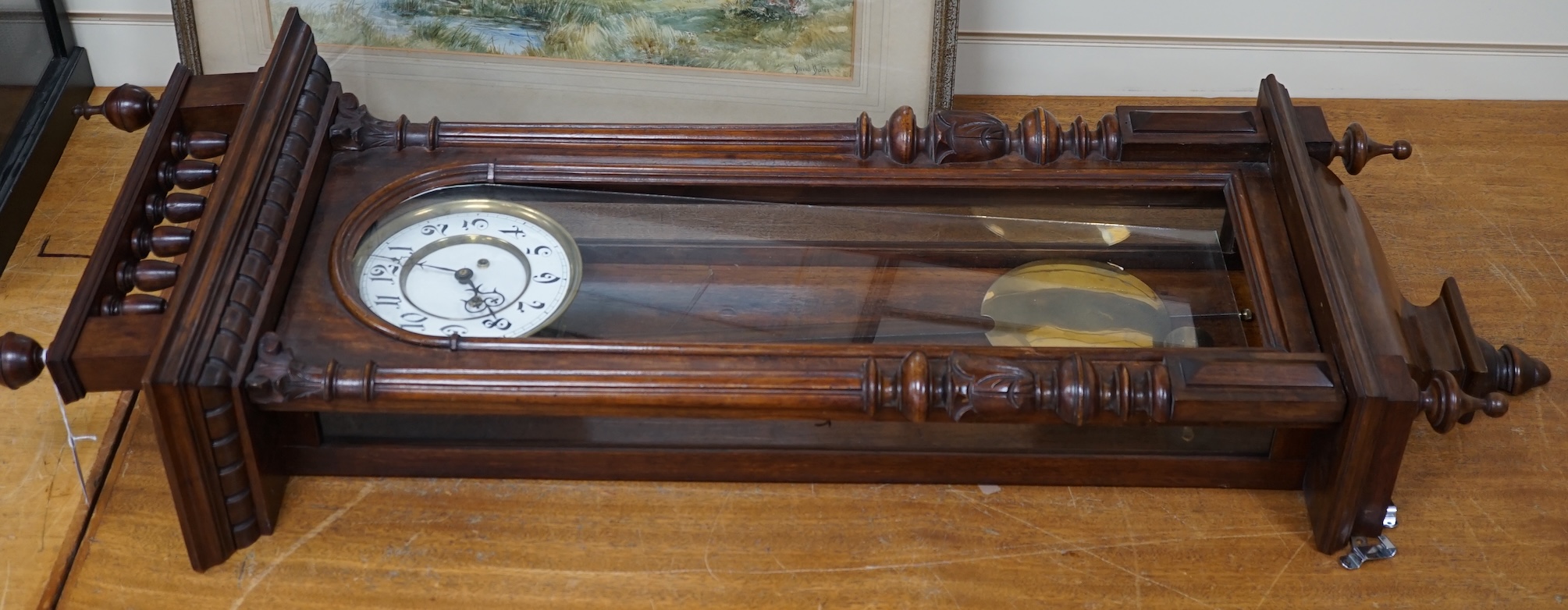 An early 20th century mahogany Vienna wall clock, 122cm. Condition - fair, glass loose, not tested as working